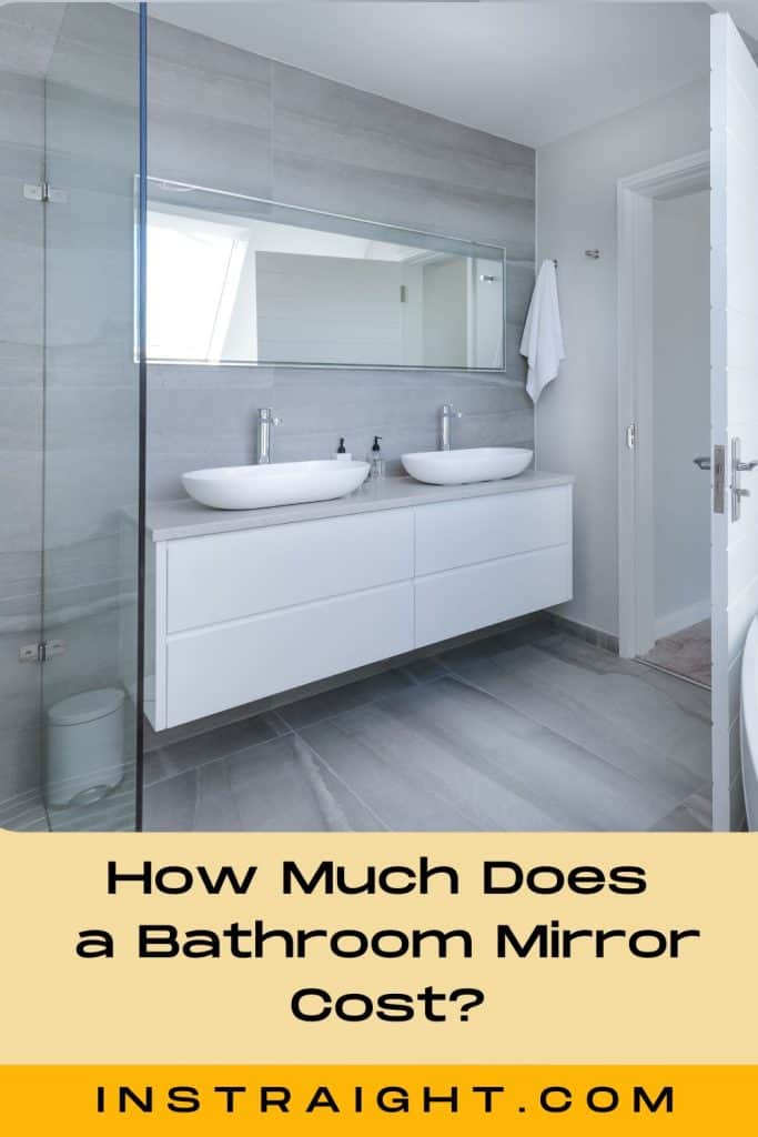 bathroom with frameless mirror